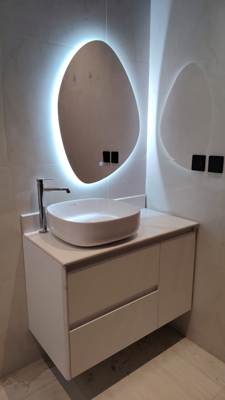 Modern Bathroom Vanity Installation: Artistic Backlit Mirror & Stylish Basin
